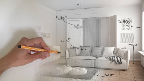 Architect interior designer concept: hand drawing a design interior project and writing notes, while the space becomes real, white scandinavian living room with kitchen