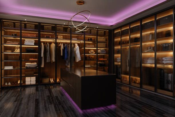Luxurious Dressing Room Interior With Walk-In Closet And Pink Neon Lighting