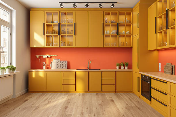 Modern Sunlit Kitchen with Mustard Yellow Cabinets and Warm Wooden Flooring